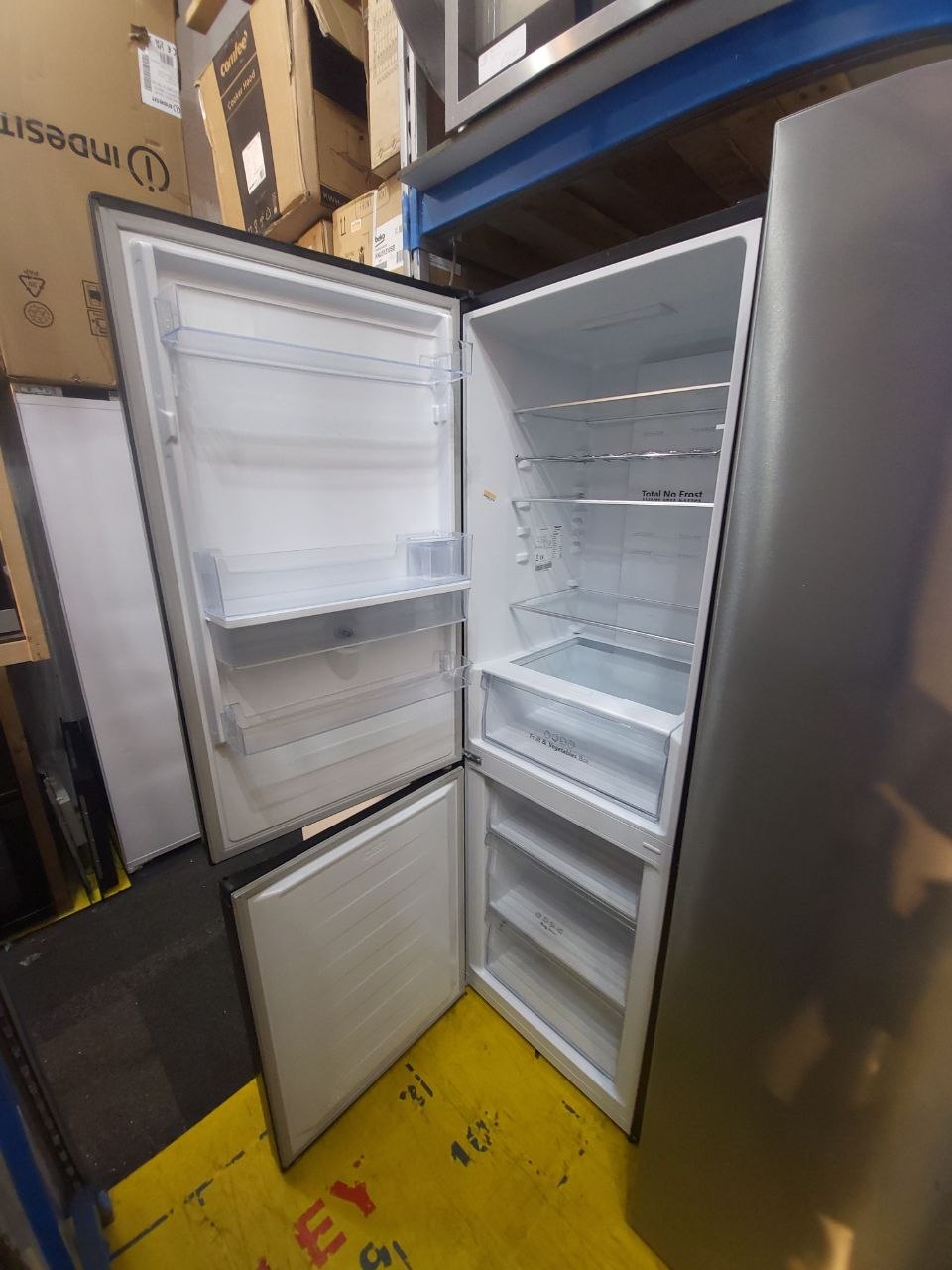 Indesit Fridge/Freezer £239 H: 185 cm W: 58 cm Fridge: 100 cm Freezer: 80 cm Water dispenser